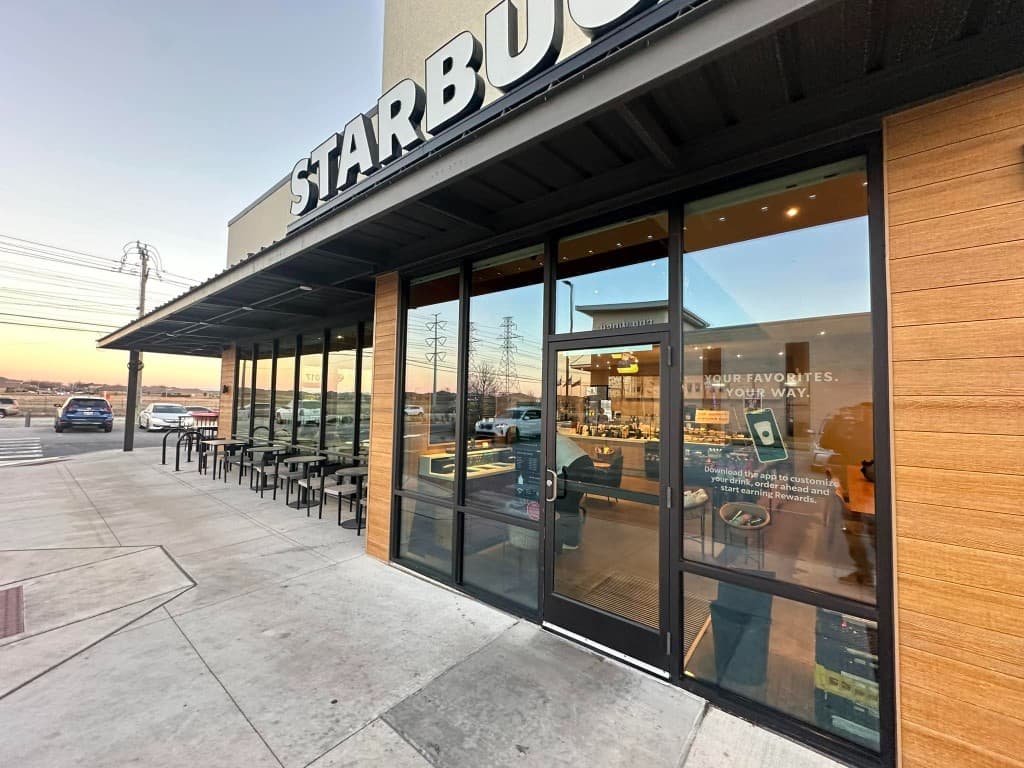 Freshly pressure-washed storefront entrance and sidewalk